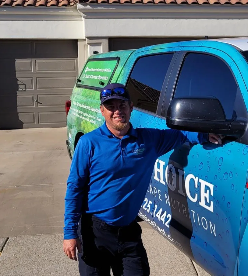 A Local Choice technician standing beside a company truck in a driveway